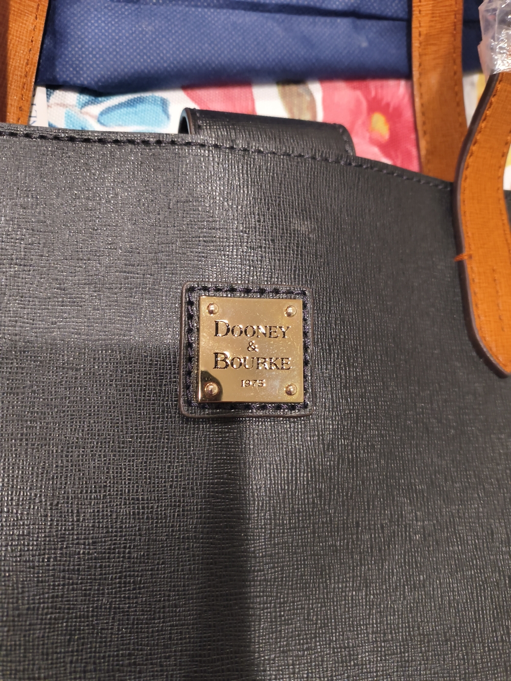 Dooney & Bourke Black Tote with Tan Handles and Gold Logo Plaque